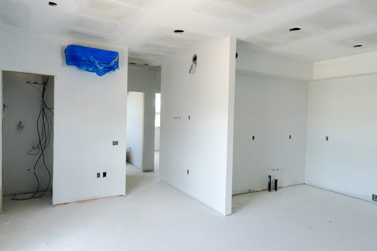M&M Painting Contractors painting in a new apartment building.