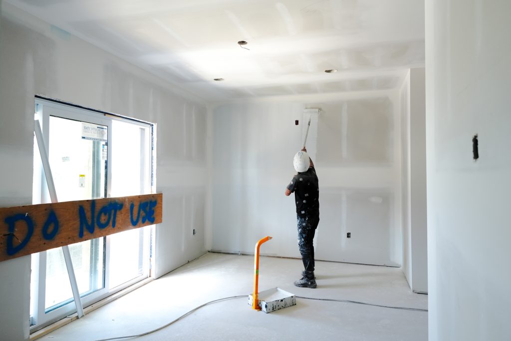 M&M Painting Contractors painting in a new apartment building.