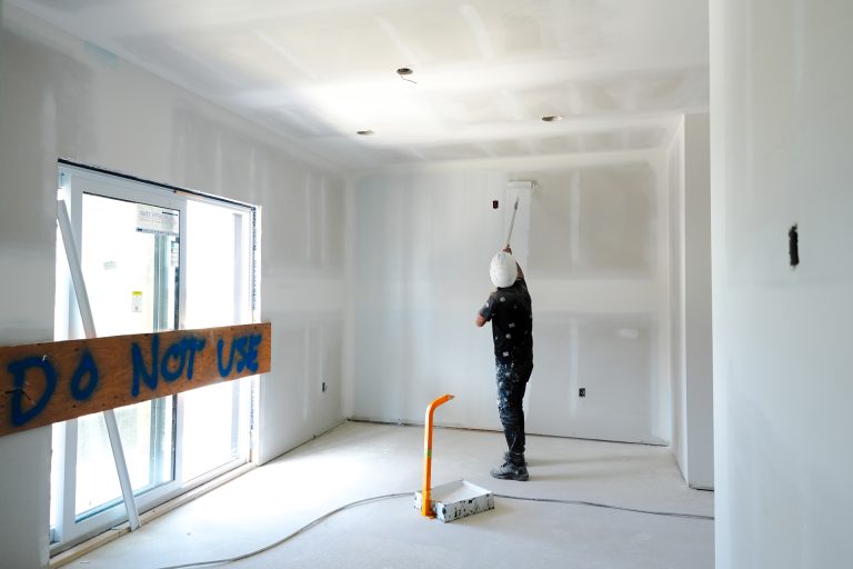 M&M Painting Contractors painting in a new apartment building.
