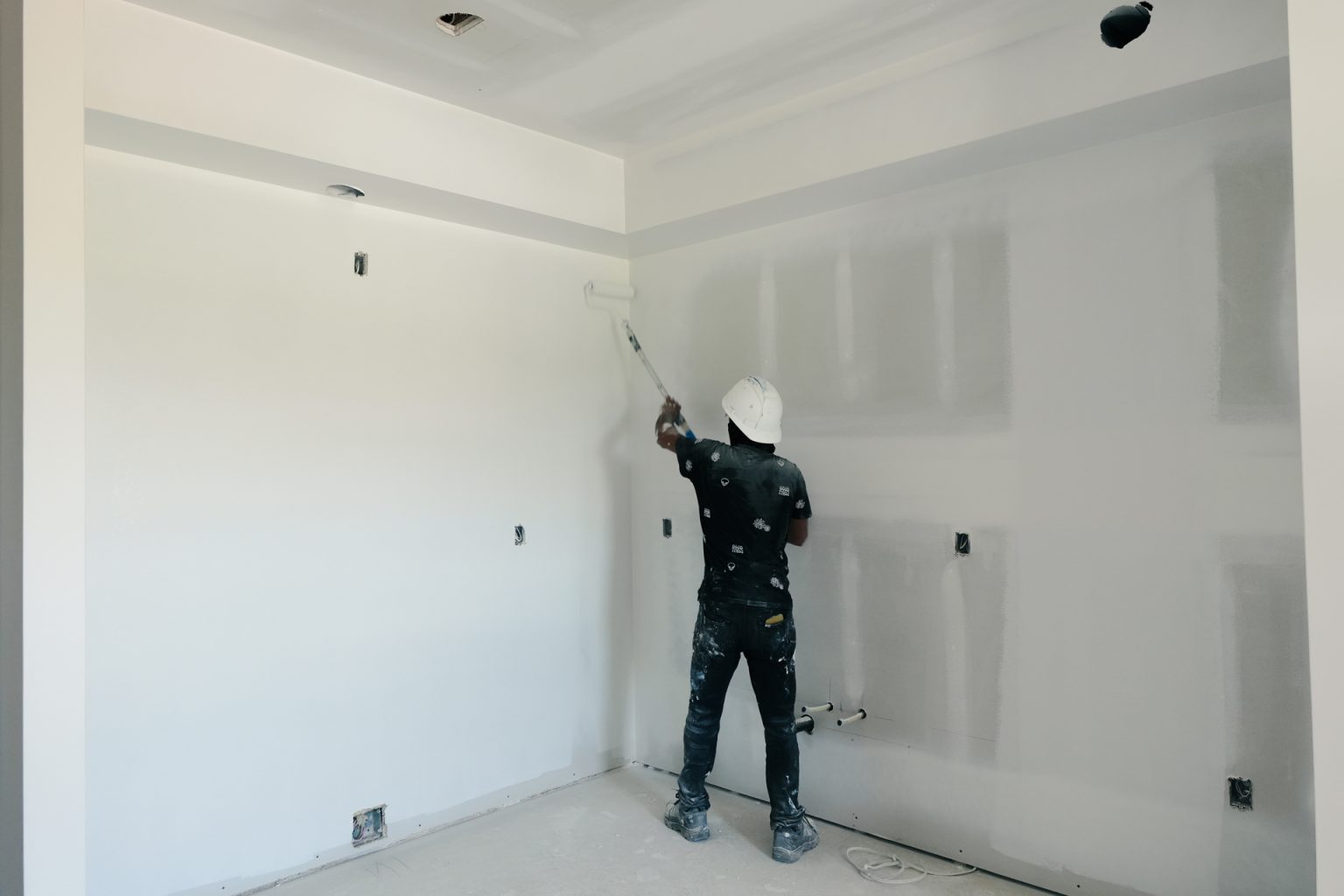 M&M Painting Contractors painting in a new apartment building.